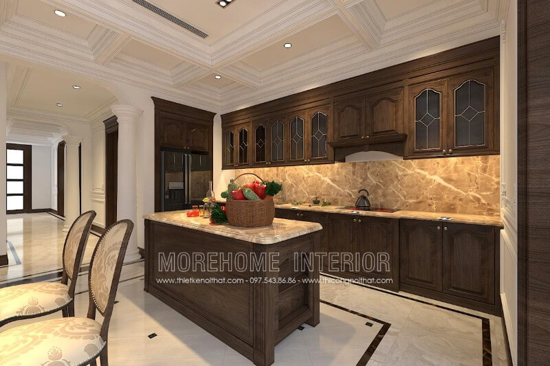 Thiết kế tủ bếp gỗ óc chó tân cổ điển kết hợp bàn đảo cùng chất liệu được đặt chính giữa tạo sự cân bằng cho không gian cũng như tiện nghi hơn cho người nội trợ Thiết kế và sản xuất tủ bếp đẹp