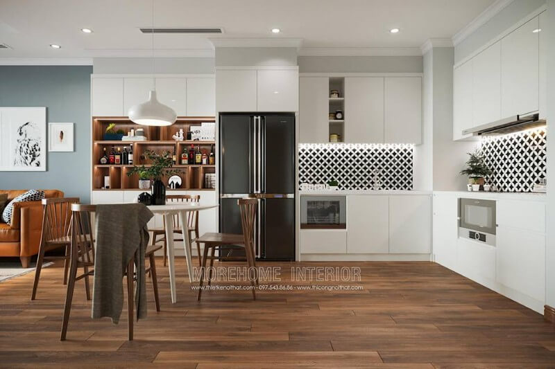 Không gian phòng bếp với tông màu trắng tinh khôi, kệ tủ gỗ công nghiệp tạo dựng khu vực chứa đồ lớn cho người nội trợ Thiết kế nhà bếp đẹp